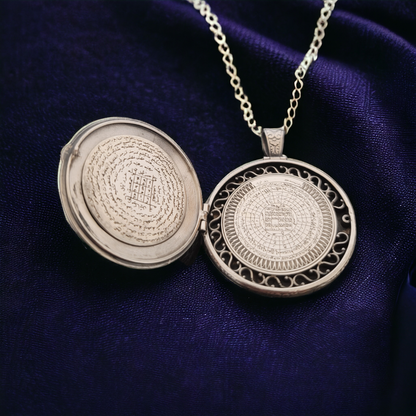 opened necklace with arabic text inside